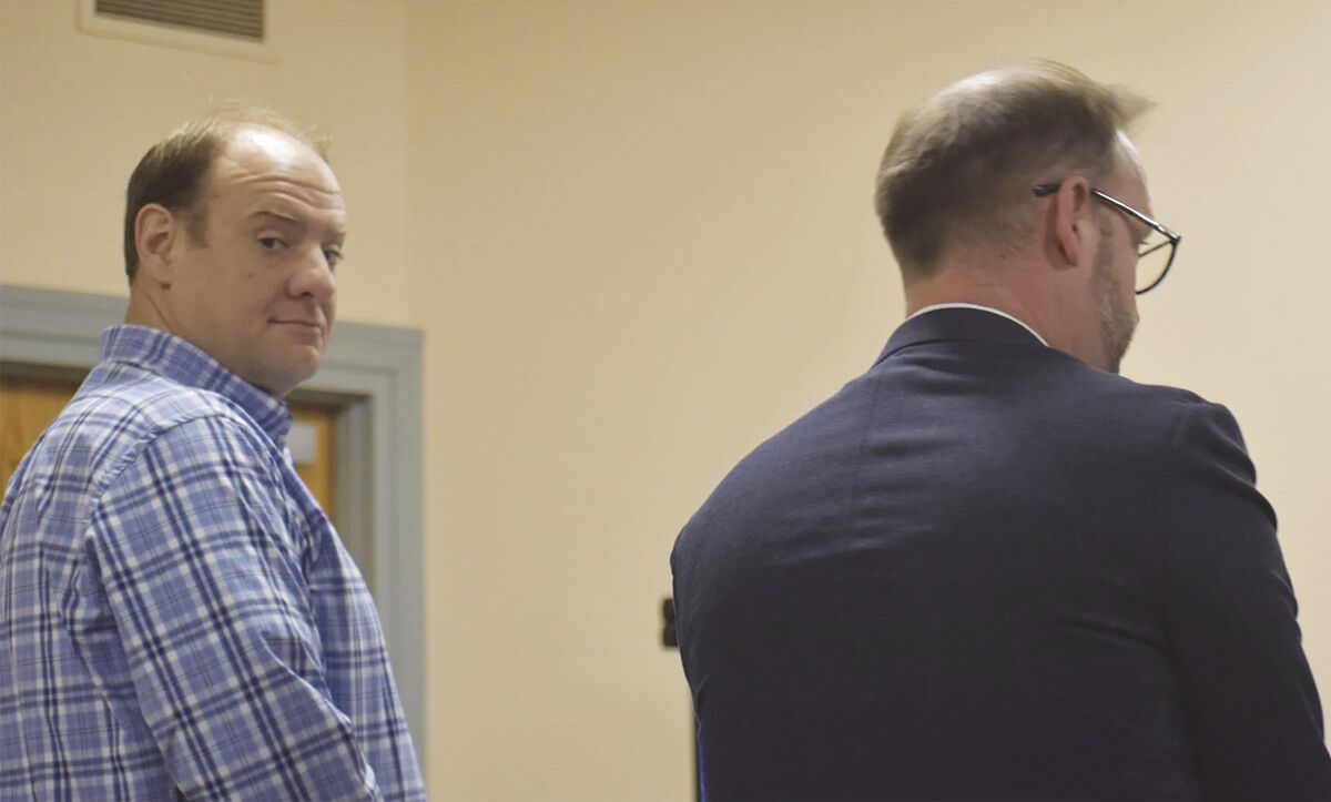 Charges reduced in Trump flag-burning case